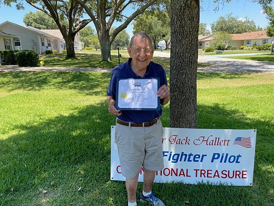 Major Jack Hallett is presented with a certificate for his Quilt of Valor by the Ocklawaha Chapter of the Daughters of the American Revolution.