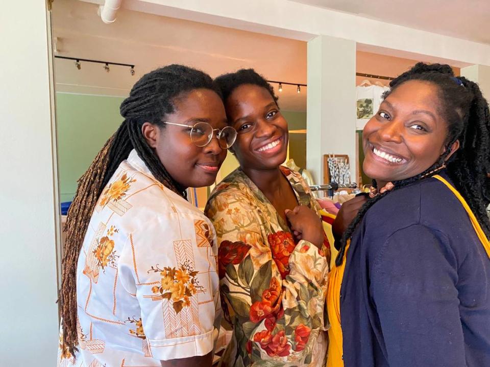 Family members and co-owners of Parable, from left, LaKecia Farmer, Le’Ecia Farmer and Deatria Williams stand inside their store on its soft opening on Aug. 21, 2021.