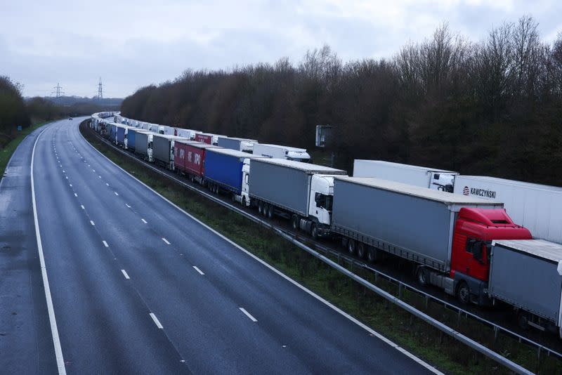 Lorries are seen parked on the M20 motorway near Ashford