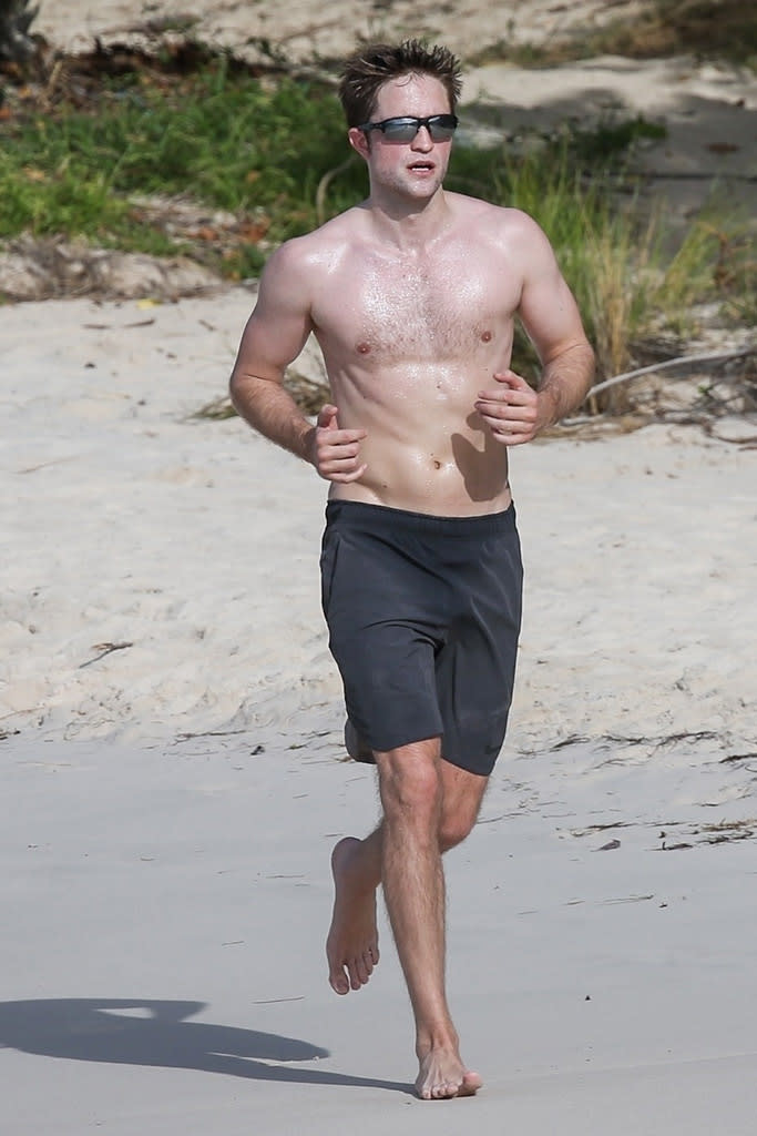 <p>The <em>Twilight</em> star may be on vacation in Antigua, but he’s not taking a break from his workout routine. The actor went for a (shirtless!) jog on the beach on Monday at Half Moon Bay, where he’s spending some downtime for the week. (Photo: Backgrid) </p>