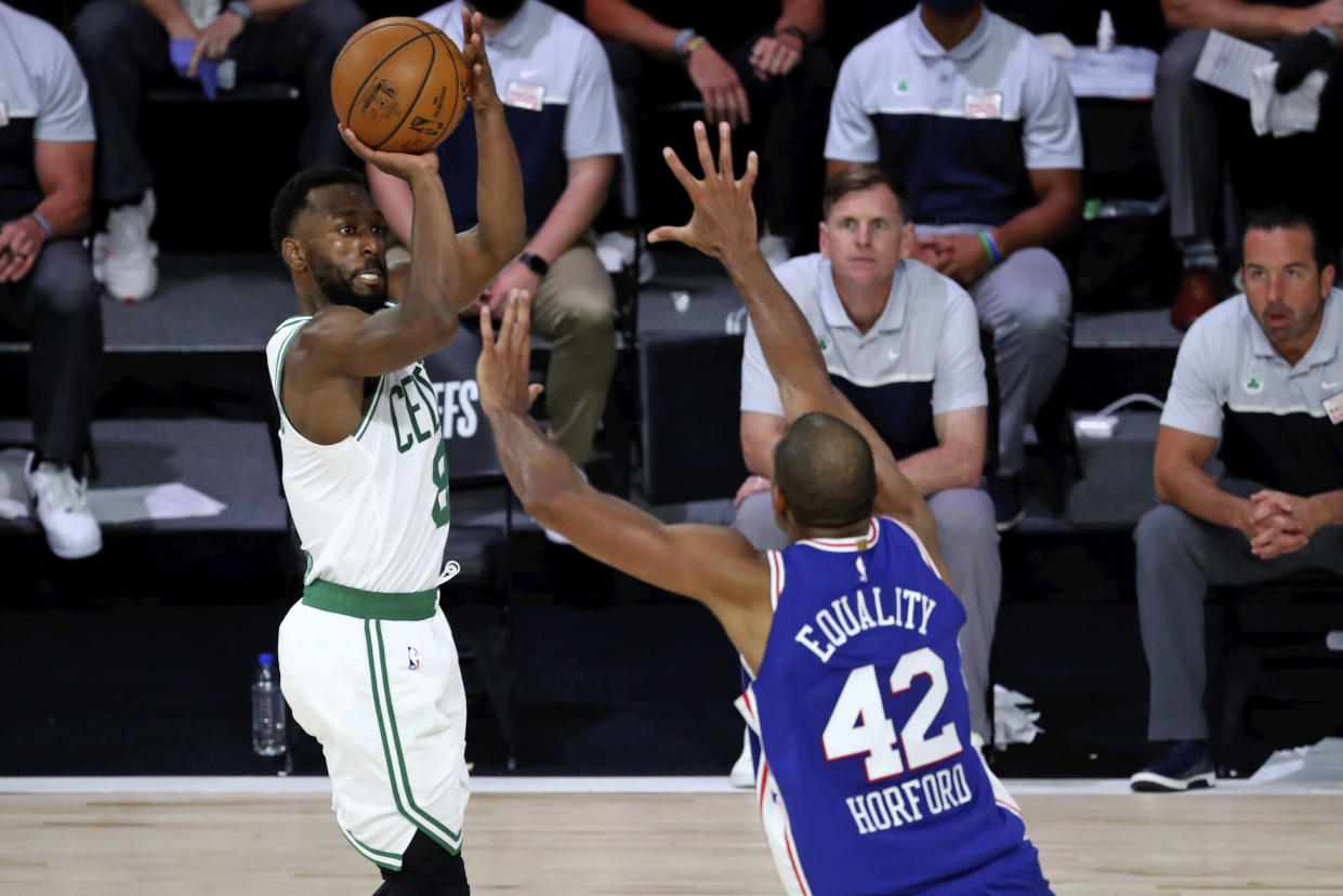 Boston Celtics guard Kemba Walker (8) shoots over Philadelphia 76ers forward Al Horford (42) during the second half in Game 3 of an NBA basketball first-round playoff series, Friday, Aug. 21, 2020, in Lake Buena Vista, Fla. (Kim Klement/Pool Photo via AP)