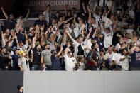 Fans celebrate after New York Yankees' Brett Gardner hit a three-run home run off Cleveland Indians relief pitcher Nick Wittgren during the seventh inning of a baseball game Friday, Sept. 17, 2021, in New York. (AP Photo/John Minchillo)