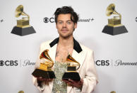 Harry Styles, winner of the award for album of the year for "Harry's House" and best pop vocal album for "Harry's House," poses in the press room at the 65th annual Grammy Awards on Sunday, Feb. 5, 2023, in Los Angeles. (AP Photo/Jae C. Hong)