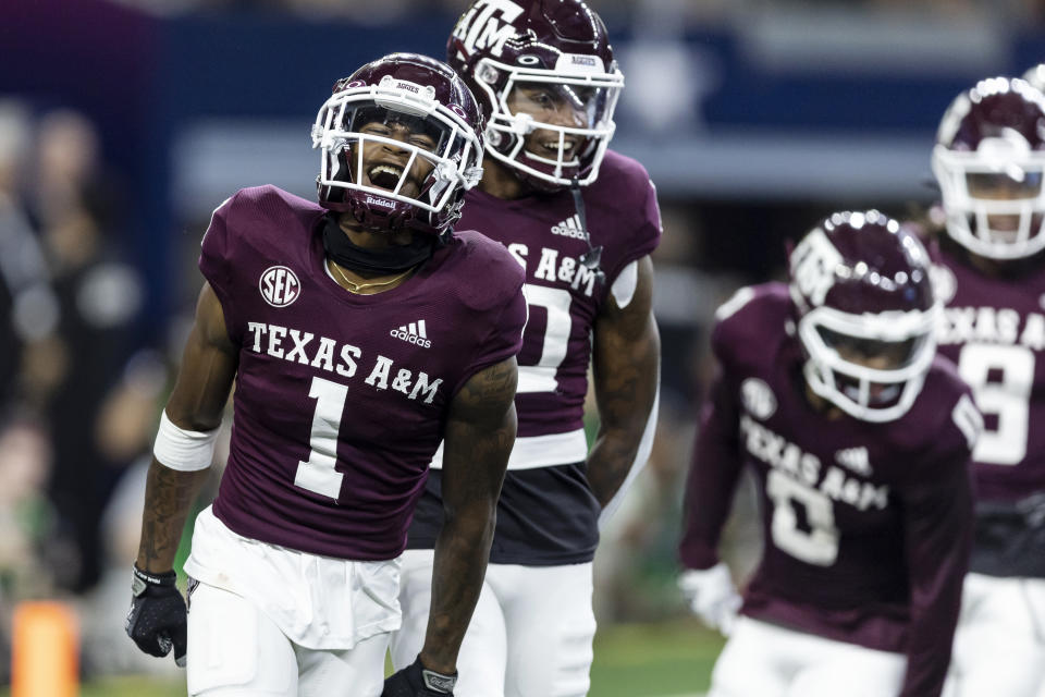 Texas A&M wide receiver Evan Stewart (1) celebrates his touchdown during the first half of the team's NCAA college football game against Arkansas on Saturday, Sept. 24, 2022, in Arlington, Texas. (AP Photo/Brandon Wade)