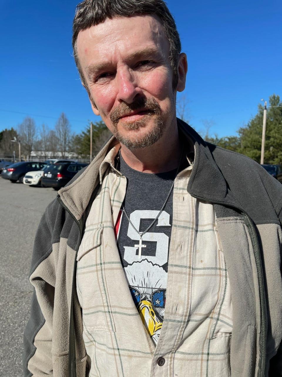 Scotty Garrett, Cody Garrett's father, donned a cross necklace with his son's name engraved on the cross during the court appearance of Richard Towe, who plead guilty to second-degree murder in Cody Garrett's homicide.