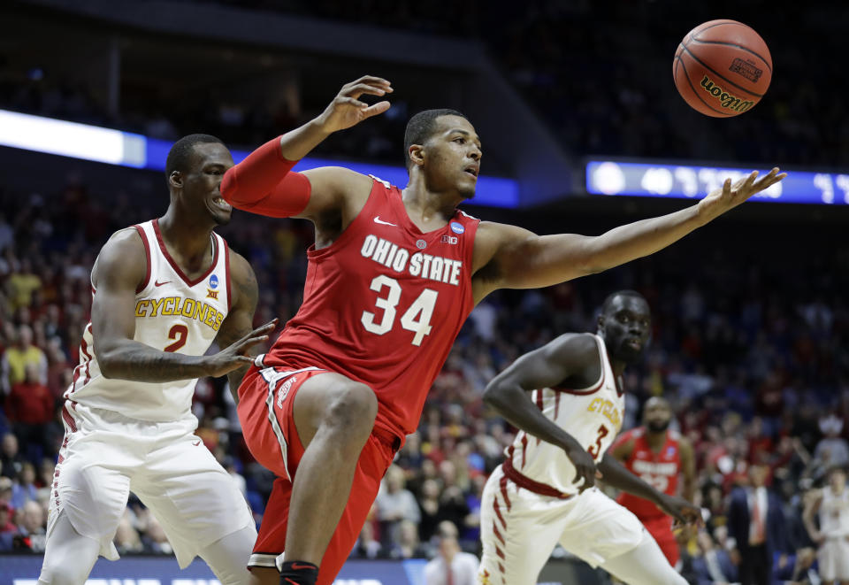 Ohio State's Kaleb Wesson (34) reaches for a rebound between Iowa State's Cameron Lard (2) and Marial Shayok (3) during the second half of a first round men's college basketball game in the NCAA Tournament Friday, March 22, 2019, in Tulsa, Okla. Ohio State won 62-59. (AP Photo/Jeff Roberson)
