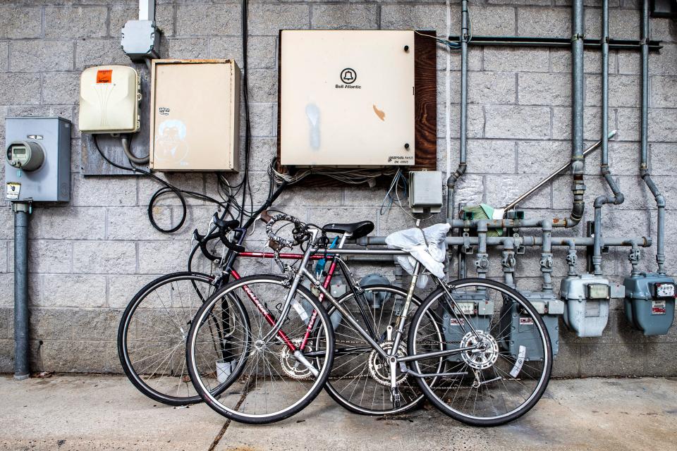 Bikes are parked at the back of a bar/restaurant on Newark's Main Street., Sunday, Jan. 29, 2023.