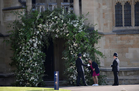 A flower arranger does last-minute preparations within Windsor Castle ahead of the wedding of Britain’s Prince Harry to Meghan Markle, in Windsor, Britain May 19, 2018. REUTERS/Toby Melville/Pool