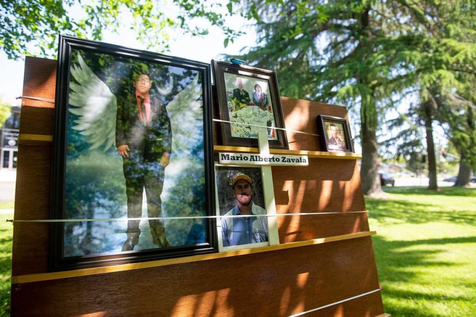 Photos of victims of violence and crime are displayed during the Merced County Victims’ Rights Ceremony at Courthouse Park in Merced, Calif., on Tuesday, April 25, 2023. The annual event held to remember victims of violence and crime, is hosted by the Merced County District Attorney’s Office during National Crime Victims’ Rights Week.