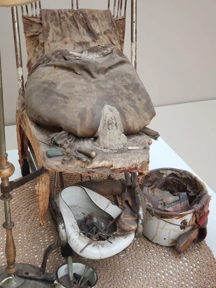 A ruptured bag of inert cement stands in for the woman in Ed Kienholz's 