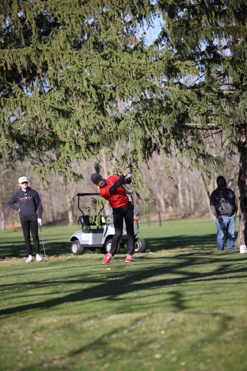 Roland-Story's Jack Birkland watches his shot during a meet on Friday, April 12, 2024, at Riverbend Golf Course.