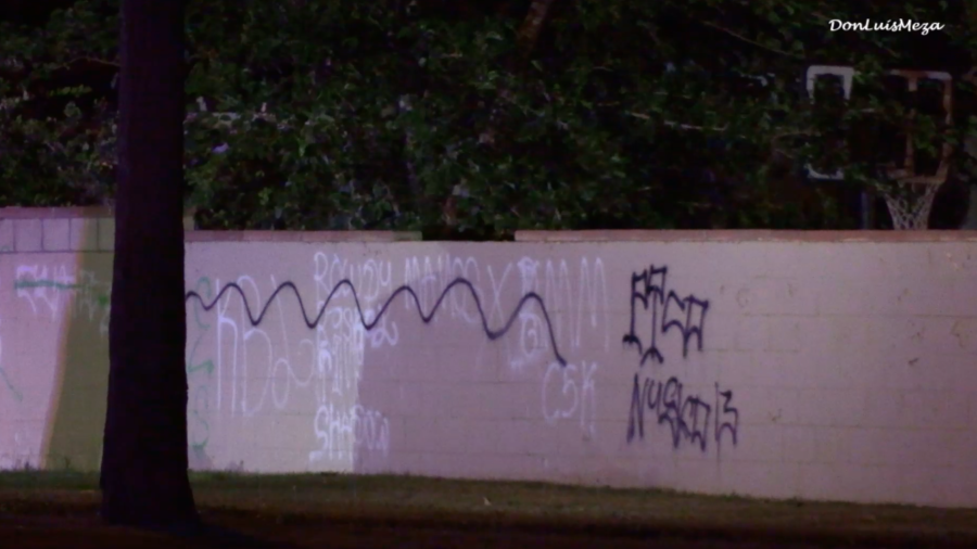 Graffiti is seen near a shooting victim in El Dorado Park in Lancaster on May 13, 2024.