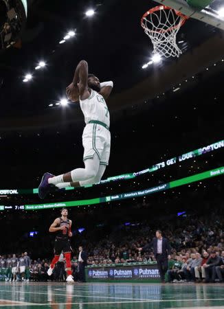 Nov 14, 2018; Boston, MA, USA; Boston Celtics guard Jaylen Brown (7) prepares to dunk the ball during the first half against the Chicago Bulls at TD Garden. Greg M. Cooper-USA TODAY Sports