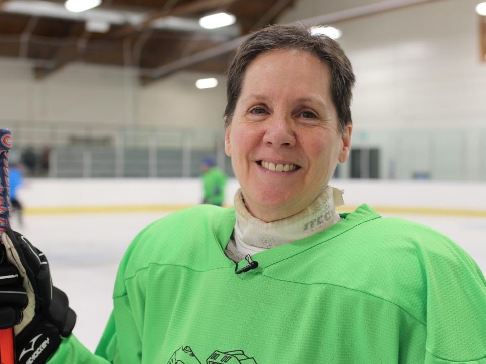 Penny Lawless is a player and organizer with the Rundle Women's Hockey League. The name was chosen in honour of Mt. Rundle, the mountain that both separates and connects Canmore and Banff.  (Paula Duhatschek/CBC - image credit)