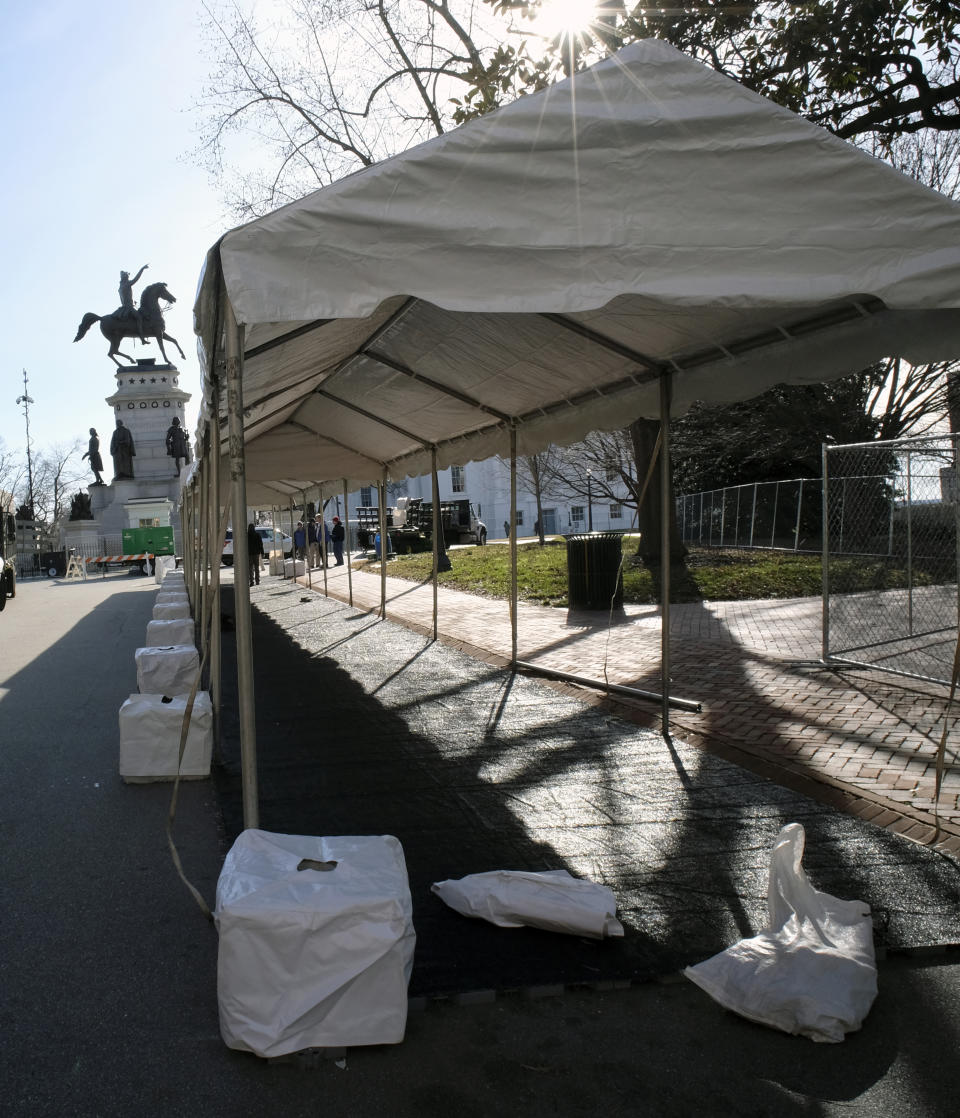 A tent is set up to house metal detectors at the entrance to Capitol Square in Richmond, Va., Friday, Jan. 17, 2020. Everyone entering the Square on Monday, Jan. 20 for the pro-gun rally must pass through this point. (Bob Brown/Richmond Times-Dispatch via AP)