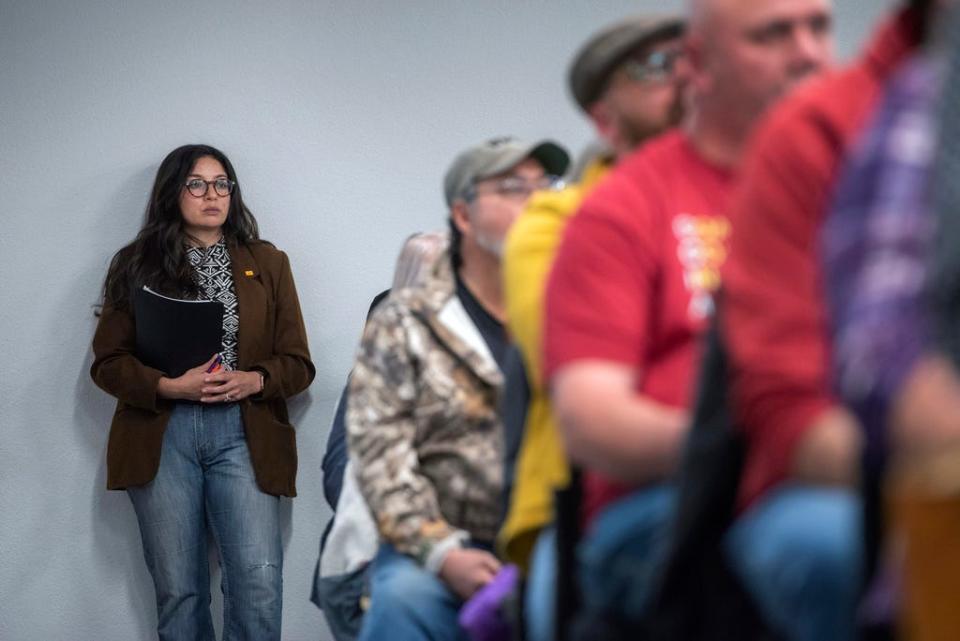 Rep. Andrea Romero, D-Santa Fe, stands in the back during a Town Council meeting in Edgewood, N.M., Tuesday, April 25, 2023. Residents of the conservative community flocked to a public meeting to discuss whether Edgewood should adopt a local abortion-ban ordinance, extending a wave of local abortion restrictions in eastern New Mexico. Romero sponsored a bill that bans public bodies in New Mexico from interfering with access to abortion or gender-affirming care.