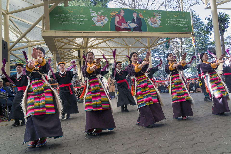 Exile Tibetan artists perform a traditional dance as they mark the anniversary of the awarding of the Nobel Peace Prize to their spiritual leader the Dalai Lama in Dharamshala, India, Sunday, Dec. 10, 2023. (AP Photo/Ashwini Bhatia)