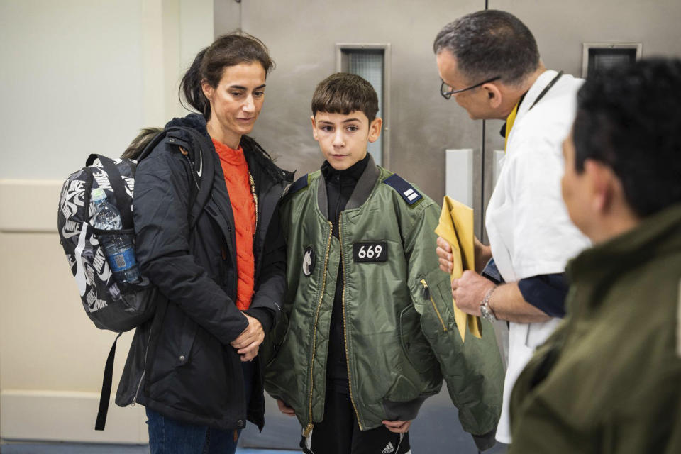 This handout photo provided by the IDF shows released Israeli hostage Eitan Yahalomi, 12, upon his arrival at Tel Aviv Sourasky Medical Center, Monday Nov. 27, 2023, after being held hostage by militant group Hamas in the Gaza Strip. (IDF via AP)