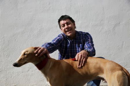 David Villanueva, 44, poses with Argi, a trained therapeutic greyhound used to treat patients with mental health issues and learning difficulties, at Benito Menni health facility in Elizondo, northern Spain, February 13, 2017.REUTERS/Susana Vera