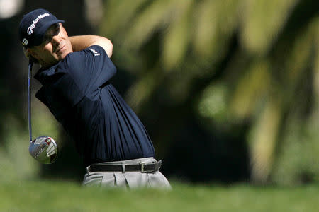 FILE PHOTO: Scott McCarron of the U.S. tees off on third hole during the second round of the Northern Trust Open PGA golf tournament at Riviera Country Club in Los Angeles, February 15, 2008. REUTERS/Danny Moloshok/File Photo