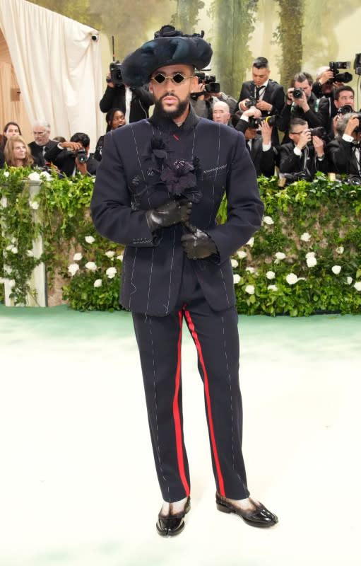 <p>Jeff Kravitz/Getty Images</p><p>The musician and 2024 co-chair carried flowers and wore a striking hat and glasses with his dark suit. </p>