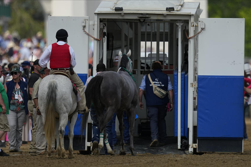 Here Mi Song is taken to the equine ambulance after the10th horse race at Churchill Downs Saturday, May 6, 2023, in Louisville, Ky. (AP Photo/Julio Cortez)