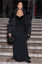 <p>Irina Shayk accessorizes her sleek black gown with a warm and cozy puffer jacket while attending the Burberry x Anne Imhof closing party in Paris on Oct. 18. </p>