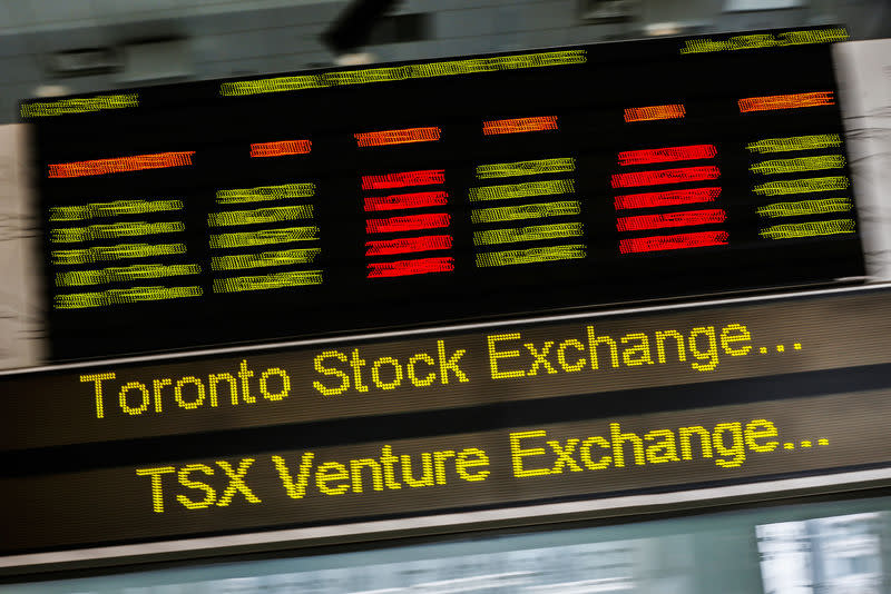 A sign board displaying Toronto Stock Exchange (TSX) stock information is seen in Toronto June 23, 2014. REUTERS/Mark Blinch