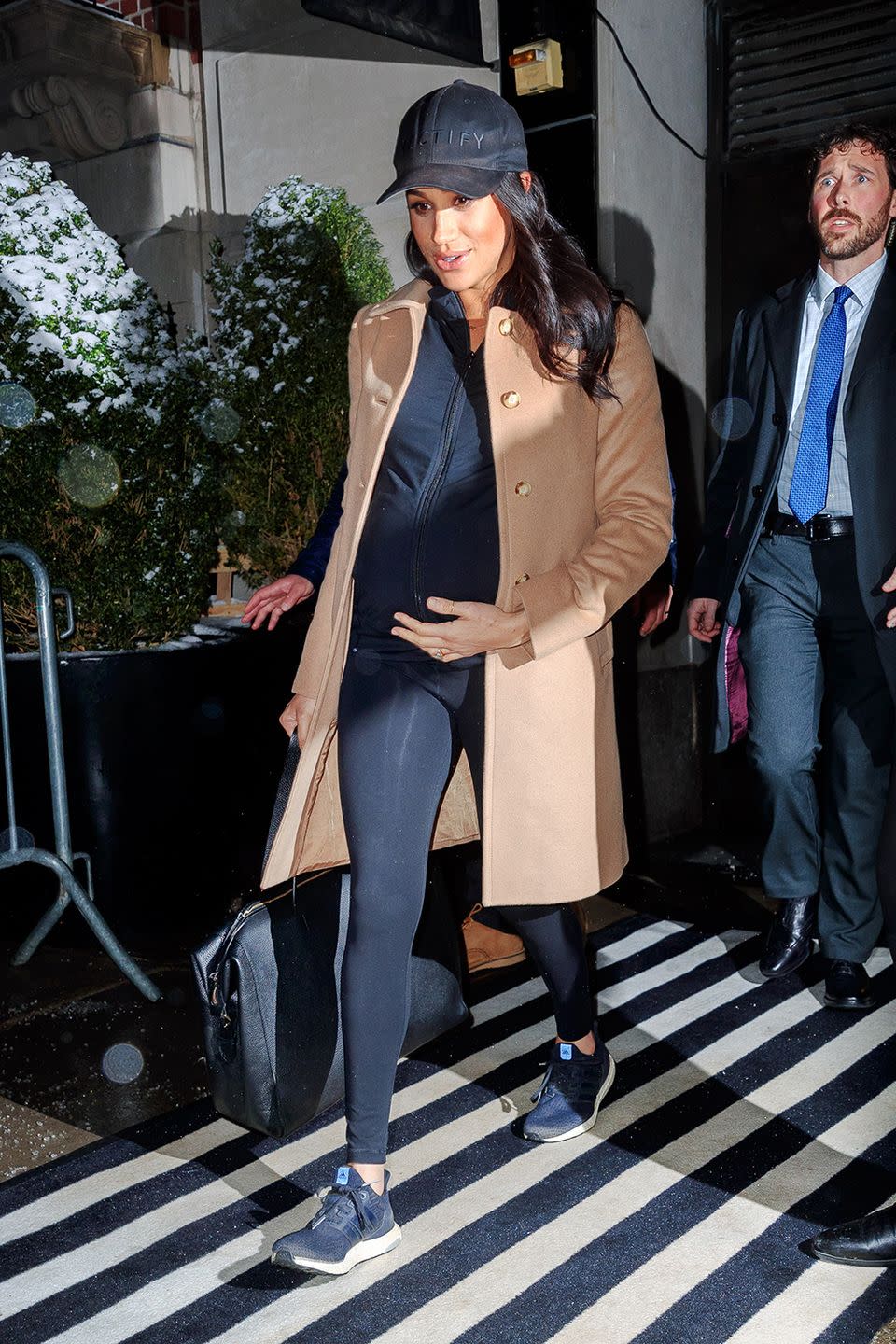 Meghan left The Mark wearing comfy gym gear following the baby shower, ready to catch a private jet home to London