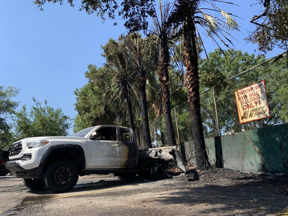 The scene a little over an hour after a fire in the parking lot of Poor Paul's Poorhouse and Bullwinkle's Saloon left two vehicles destroyed, Wednesday, June 22, 2022.