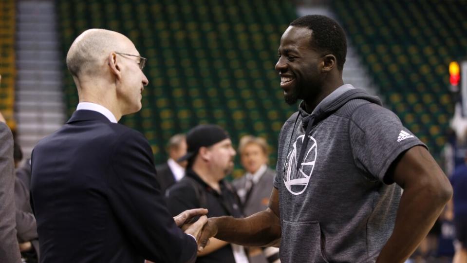 Golden State Warriors' Draymond Green (23) talks with NBA commissioner Adam Silver before the Warriors game against the Utah Jazz for Game 3 of their NBA second-round playoff series at Vivint Smart Home Arena in Salt Lake City, Utah, on Saturday, May 6, 2