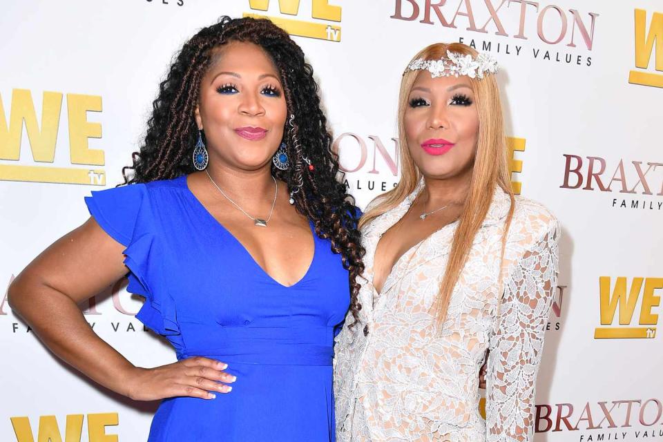 <p>Earl Gibson III/Getty Images for WE tv</p> Trina Braxton and Traci Braxton in West Hollywood in April 2019