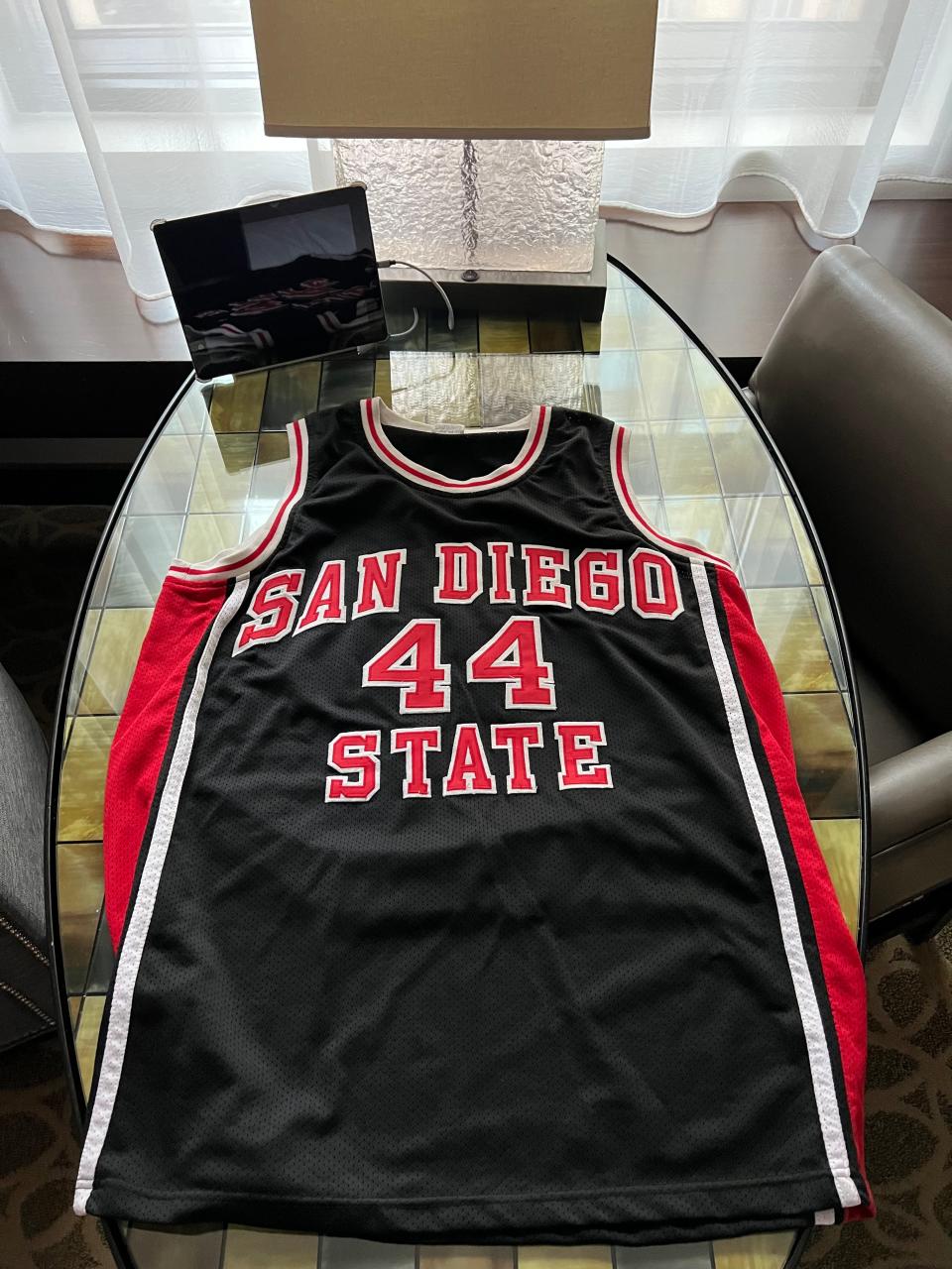 Thunder broadcaster and San Diego State alum Michael Cage will wear his No. 44 jersey Monday night in Houston, while rooting on the Aztecs against UConn in the NCAA men's basketball championship game.