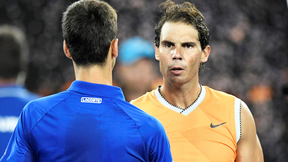 Novak Djokovic embraces Rafael Nadal. (Photo by Recep Sakar/Anadolu Agency/Getty Images)