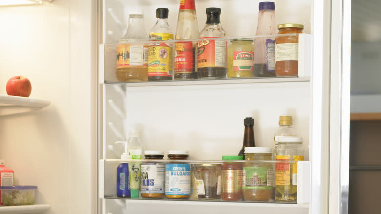 condiment bottles and jars in fridge