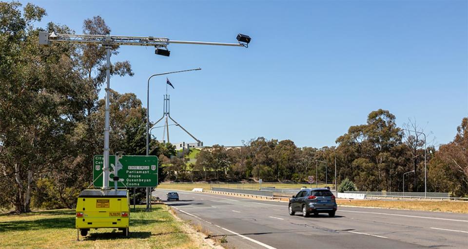 A car driving past a mobile detection camera in Canberra.