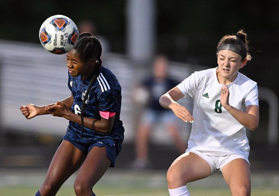 Twinsburg's Jadyn Harris, left, heads the ball in front of Nordonia's Riley Tyson during the second half of a soccer game, Wednesday, Sept. 7, 2022, in Twinsburg, Ohio.