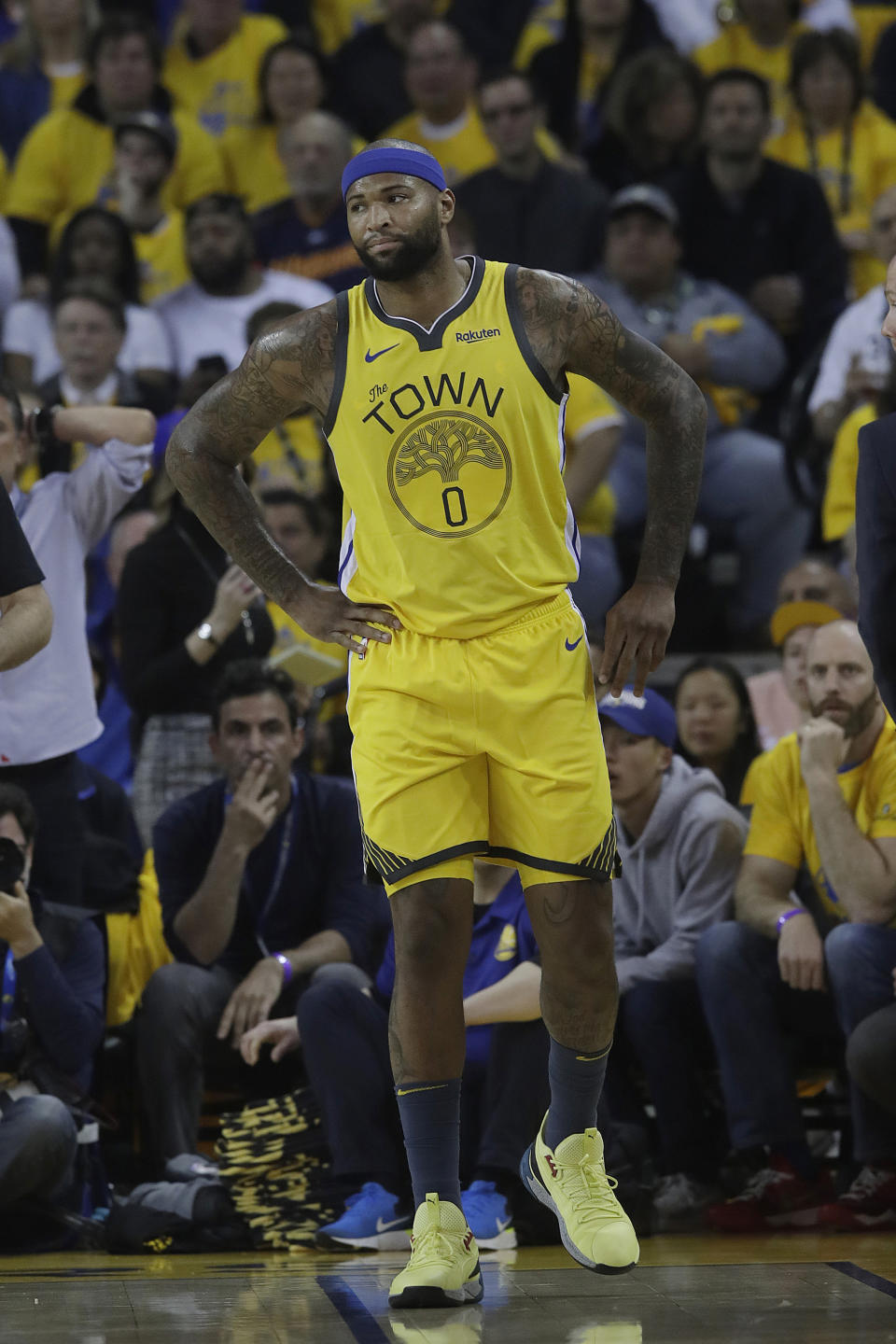 FILE - In this April 15, 2019, file photo, then-Golden State Warriors center DeMarcus Cousins reacts after injuring his leg during the first half of Game 2 of a first-round NBA basketball playoff series against the Los Angeles Clippers in Oakland, Calif. A person with knowledge of the situation says Los Angeles Lakers center DeMarcus Cousins is undergoing tests to confirm a preliminary diagnosis of a ligament tear in his knee. Cousins was injured in a workout in Las Vegas this week, according to the person who spoke on condition of anonymity to The Associated Press on Thursday, Aug. 15, 2019, because no official diagnosis has been released publicly. (AP Photo/Jeff Chiu, File)