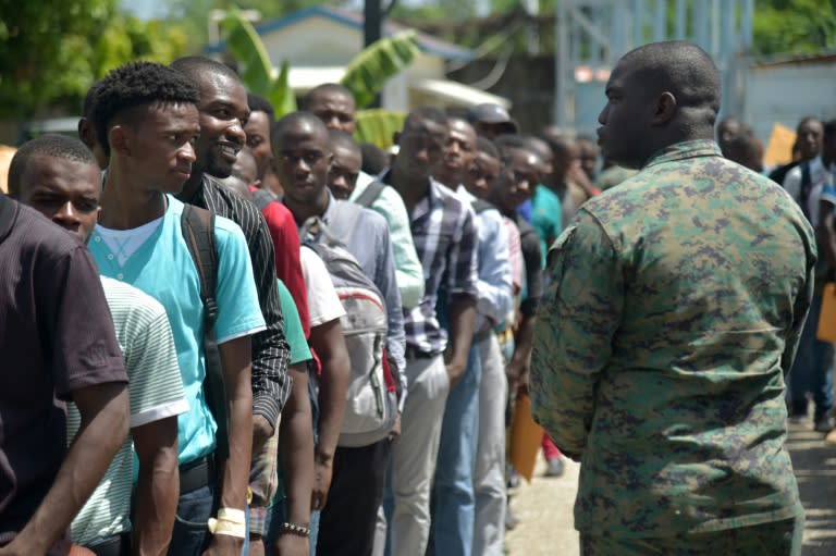 Haiti dissolves its army in 1995 after decades of coups and military interference in politics