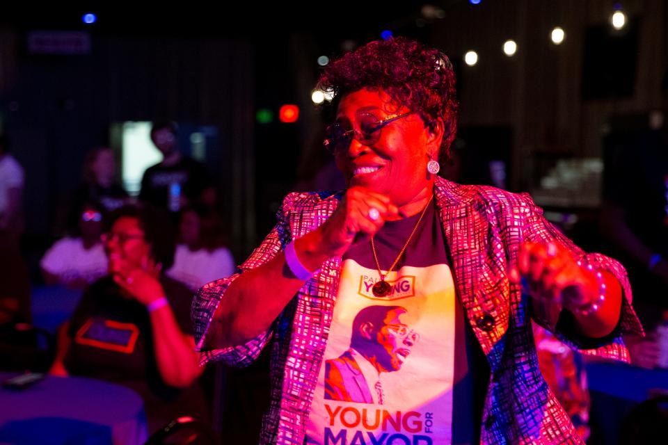 Loamma Smith dances along to music after early voting results for mayor are projected onto a screen showing Young in the lead at an election watch party for Young at Minglewood Hall in Memphis, Tenn., on Thursday, October 5, 2023. “He’s looking out for the young kids,” Smith said on why she supports Young. “He’s looking out for the future kids, my grandkids.”