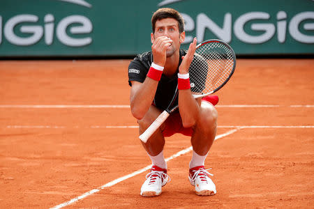 Tennis - French Open - Roland Garros, Paris, France - June 5, 2018 Serbia's Novak Djokovic reacts during his quarter final match against Italy's Marco Cecchinato REUTERS/Charles Platiau