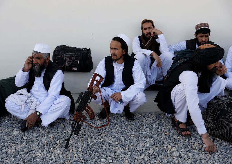 Newly freed Taliban prisoners sit at Pul-i-Charkhi prison, in Kabul, Afghanistan