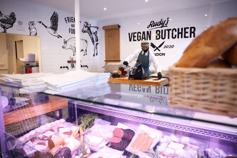 A member of staff works inside 'Rudy's Vegan Butcher' shop, amid the coronavirus (COVID-19) outbreak, in London