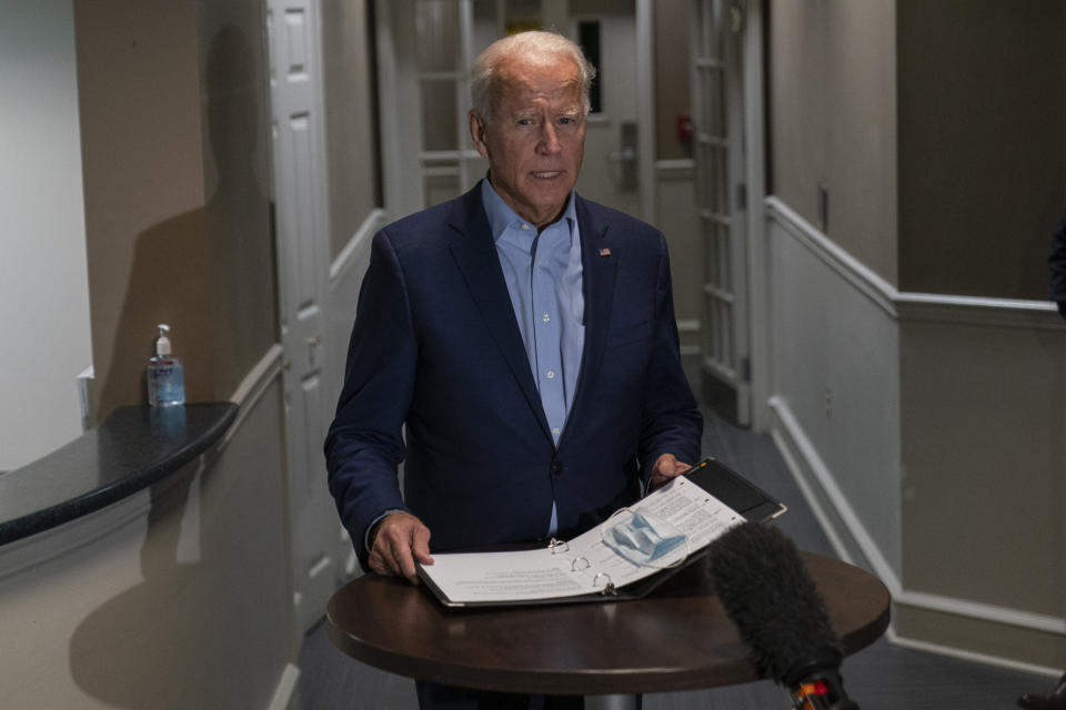 Democratic presidential candidate former Vice President Joe Biden speaks about the death of Supreme Court Justice Ruth Bader Ginsburg after he arrives at at New Castle Airport, in New Castle, Del., Friday, Sept. 18, 2020, as he returns from Duluth, Minn. (AP Photo/Carolyn Kaster)