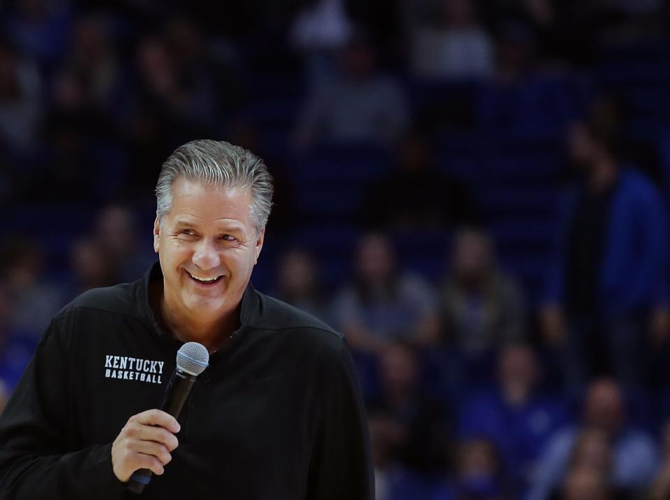 Kentucky's coach John Calipari is all smiles as he tells the crowd the may see some zone play during the Blue-White scrimmage at Rupp Arena on Oct. 18, 2019
