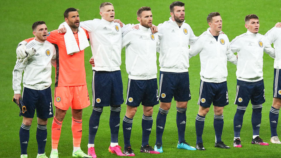 The Scotland team, pictured here singing the National Anthem before their clash with England.