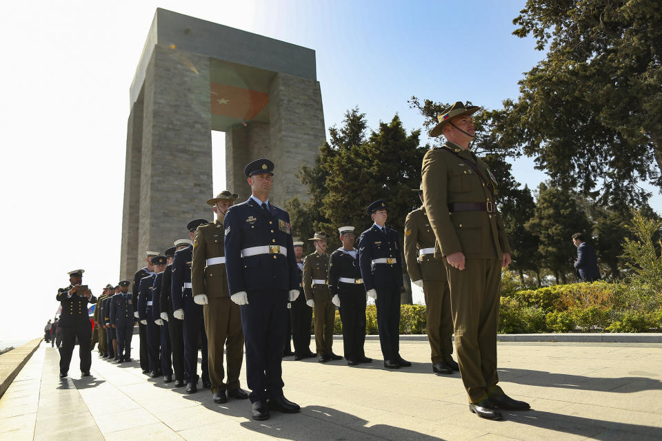 Australian and New Zealand soldiers stand during the international service in recognition of the Gallipoli campaign at Mehmetcik monument in the Gallipoli peninsula, Turkey, Sunday, April 24, 2022. The annual Anzac Day ceremony on Monday, April 25 remembers the forces of the Australian and New Zealand Army Corps under British command in World War I who fought a bloody nine-month battle against Turkish forces on the Gallipoli peninsula in 1915. (AP Photo/Emrah Gurel)