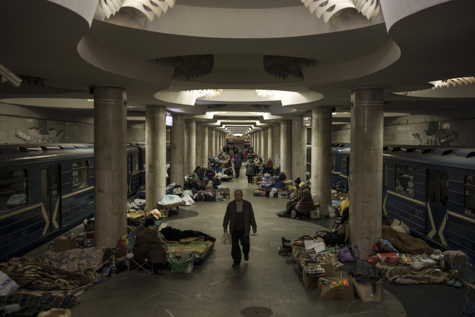 FILE - People stay in a metro station being used as a bomb shelter in Kharkiv, Ukraine, Saturday, March 26, 2022. With its aspirations for a quick victory dashed by a stiff Ukrainian resistance, Russia has increasingly focused on grinding down Ukraine’s military in the east in the hope of forcing Kyiv into surrendering part of the country’s eastern territory to end the war. If Russia succeeds in encircling and destroying the Ukrainian forces in Donbas, the country’s industrial heartland, it could try to dictate its terms to Kyiv -- and possibly attempt to split the country in two. (AP Photo/Felipe Dana)