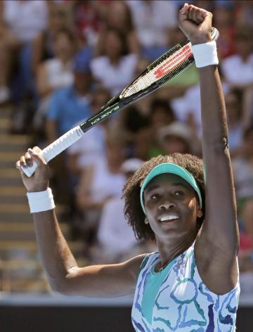 Venus Williams of the U.S. celebrates after defeating Camila Giorgi of Italy in their third round match at the Australian Open tennis championship in Melbourne, Australia, Saturday, Jan. 24, 2015. (AP Photo/Bernat Armangue)