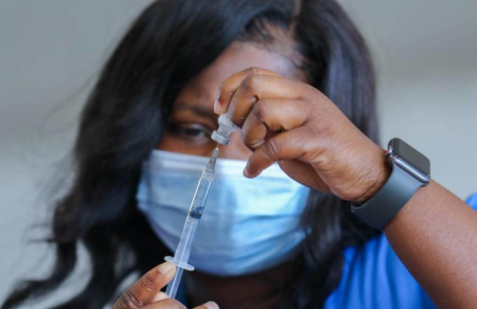 Naomi Frazier, a nurse with DHEC, fills vaccinations at a mass-vaccination site set up by FEMA at the Columbia Place Mall in Columbia. The site will provide about 1,000 vaccines daily. 4/13/21